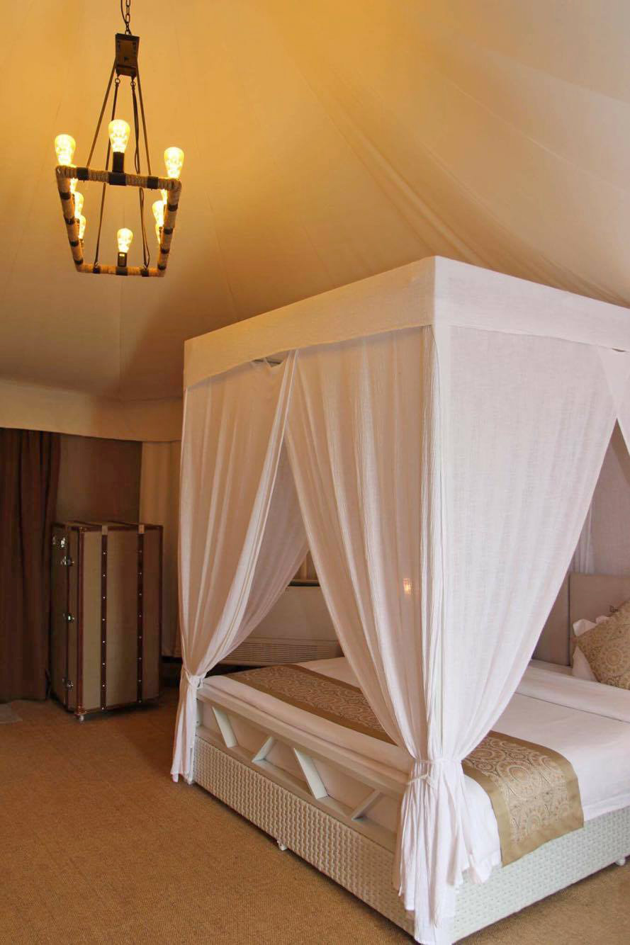 the-canopi-bintan-resorts-glamping-tent-bedroom-bed