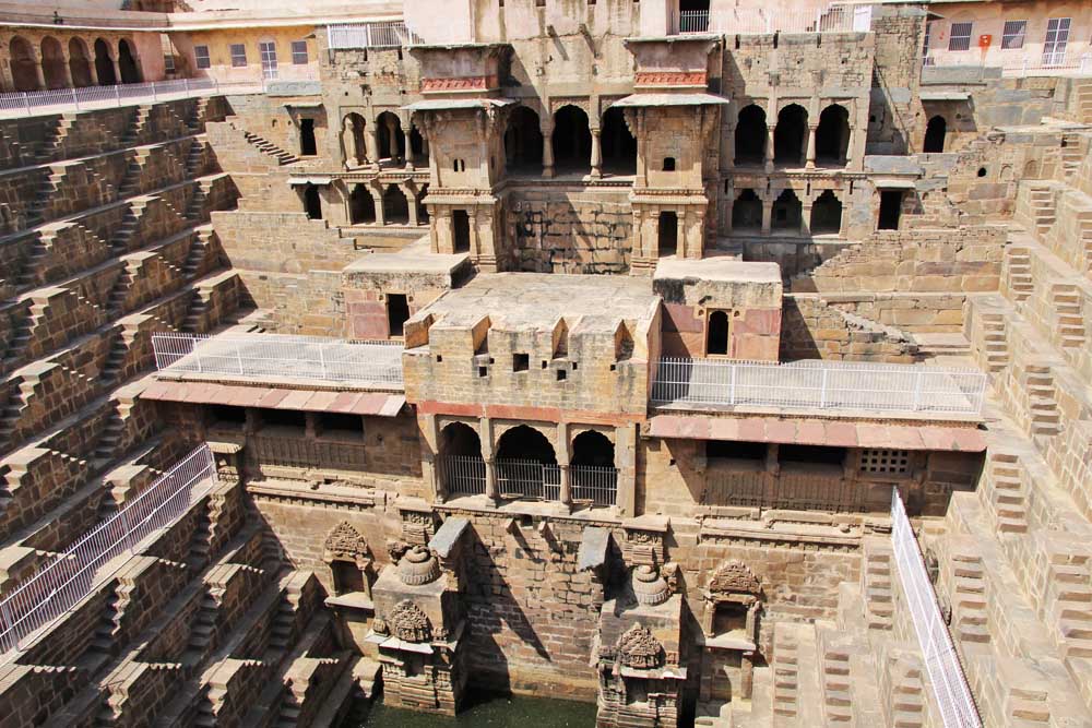 chand-baori-ancient-stepwell-india-jaipur-rajasthan-people-face-of-indian-batman-film-location-hindu-carving